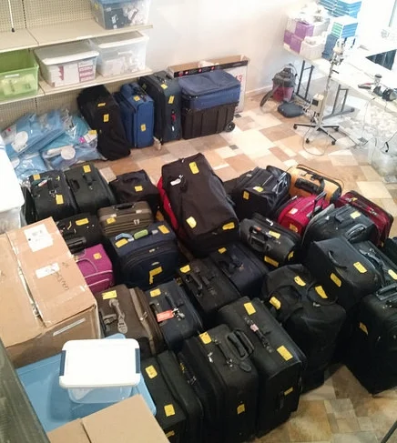 Suitcases with supplies, packed and ready to send to Bolivia, in our Evanston office.