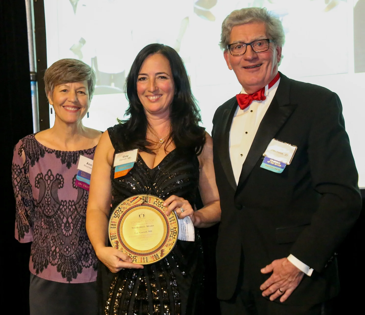 (From left) Executive Director Ann Rhomberg, honoree Dr. Gay Garrett, and Solidarity Bridge Board Chair Dale Granchalek at Fiesta 2018.