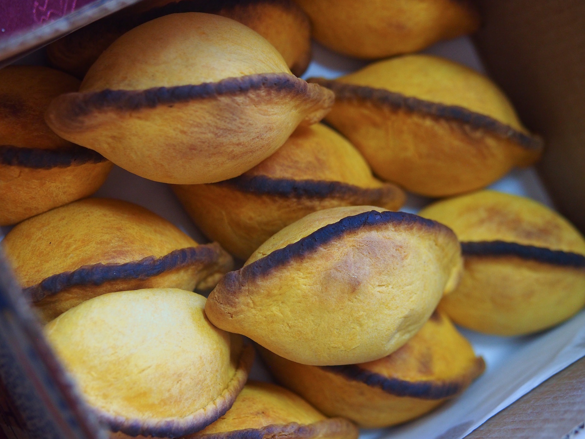     Salteñas —savory meat pies filled with meat or chicken—are a light meal or snack. “A true Bolivian will be able to eat it without leaving any liquid on the plate,” using a spoon to catch the delicate broth, says Encinas. 