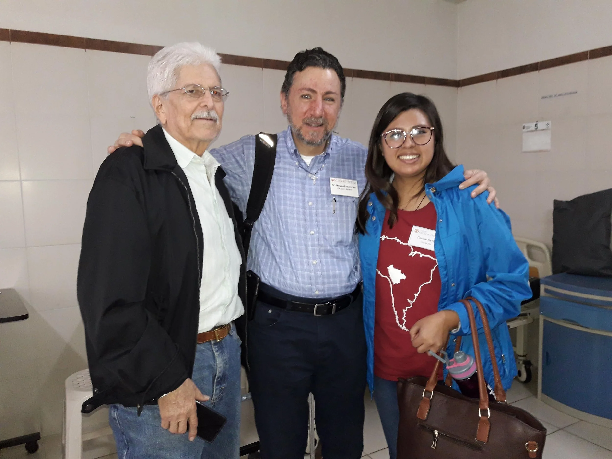 Before his surgery, Jose offered a serenade for Dr. Magued Khouzam and volunteer interpreter, Denise.