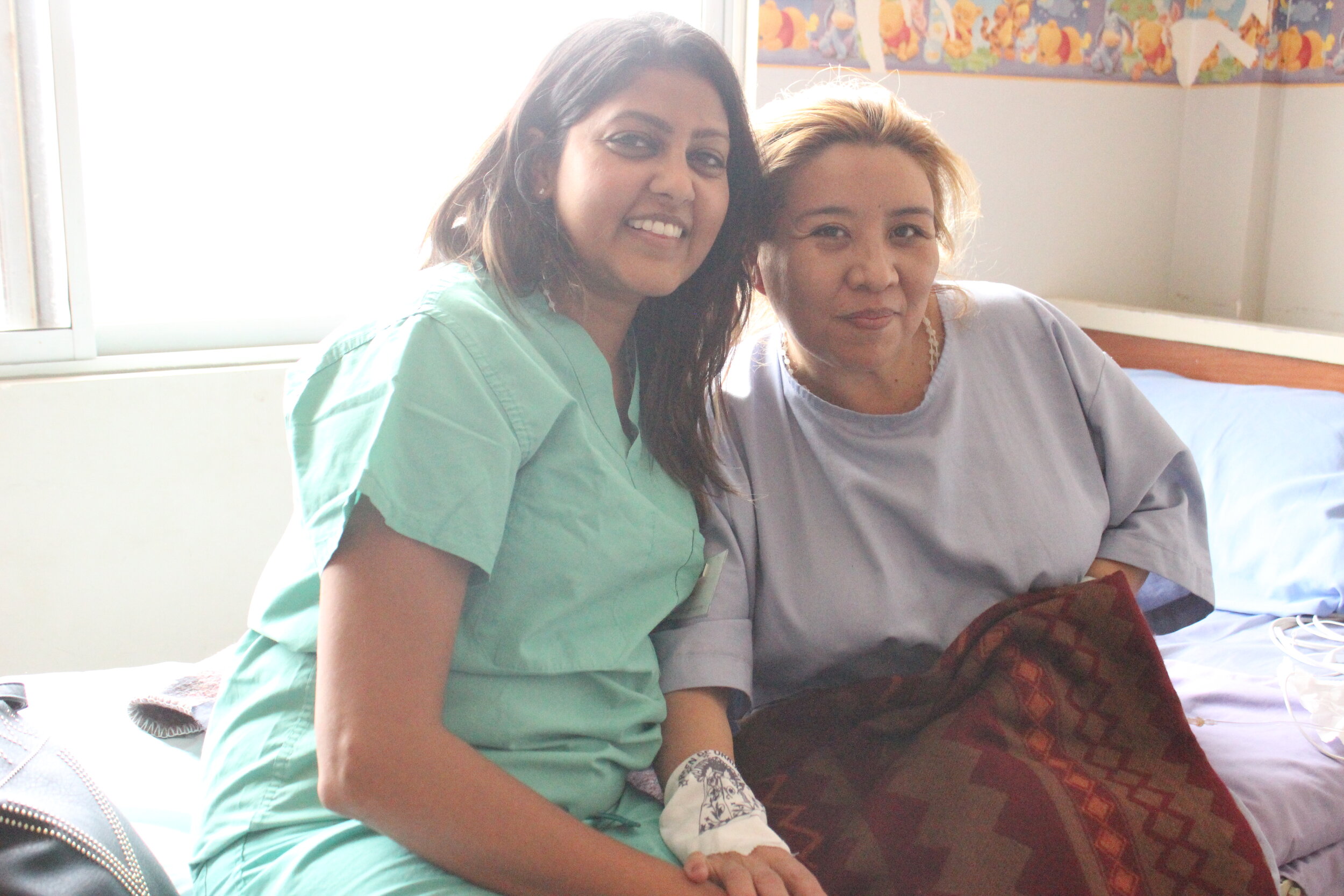  Shelly visits with one of her surgical patients, Galia.  