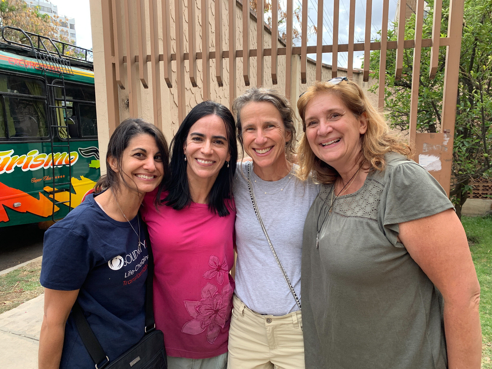  members of the MSMT team smile outside of the Puente de Solidaridad offices in Cochabamba 