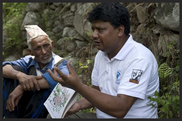A Brooke Nepal Animal Welfare Facilitator explains the importance of Tetanus vaccinations to a group of equine owners.