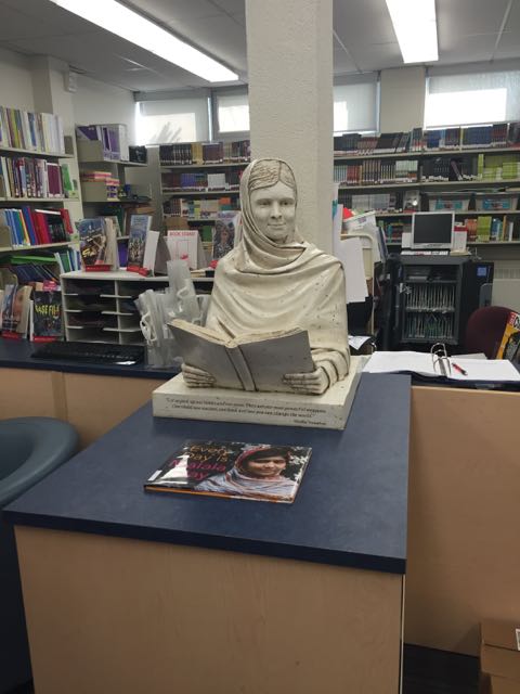 Malala sculpture at home in the Allan A Martin Sr. Public School library