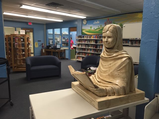 Malala sculpture at home in the Greenbriar Middle School library