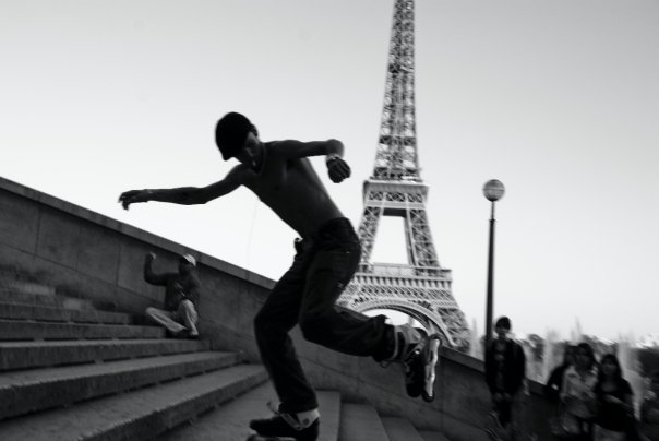  Man rollerblades backwards down stairs. Paris, France. 