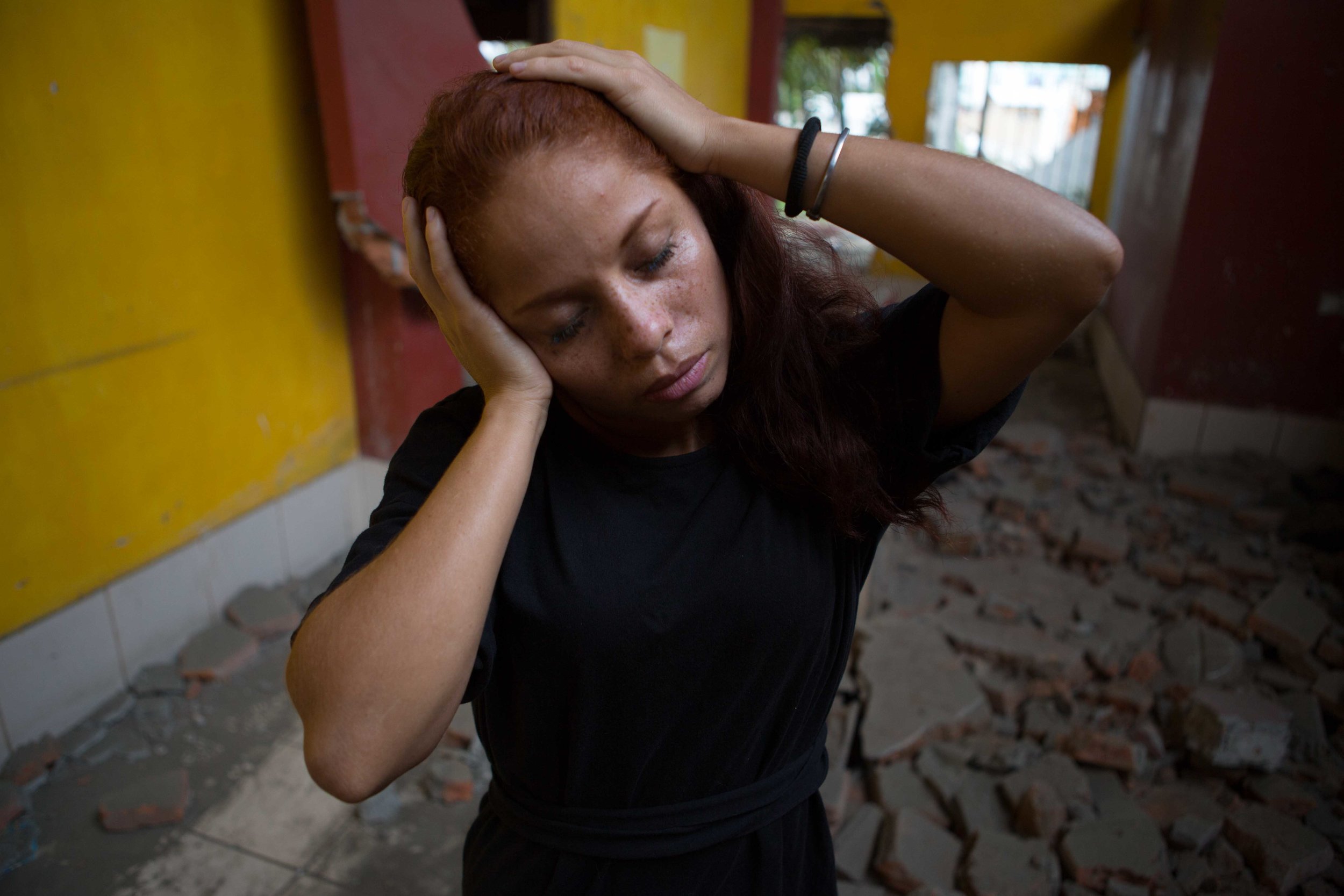  Women stands amongst earth quake rubble in Pedernales, Ecuador 2016.&nbsp; 