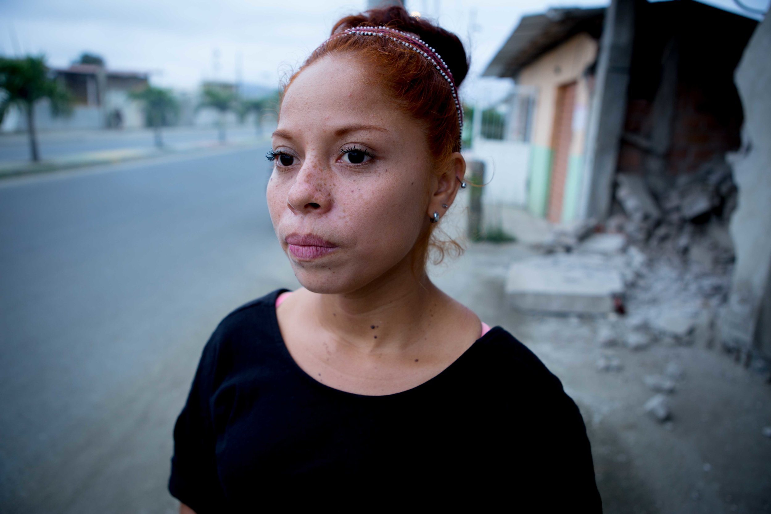  Woman stands on streets of Pedernales, Ecuador.&nbsp; 