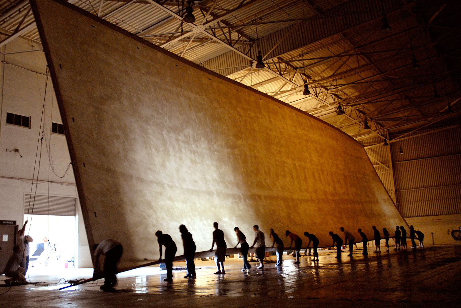 Twenty people test-raised the unsensitized photograph's canvas base into place inside the camera: total weight: 1,200 pounds.