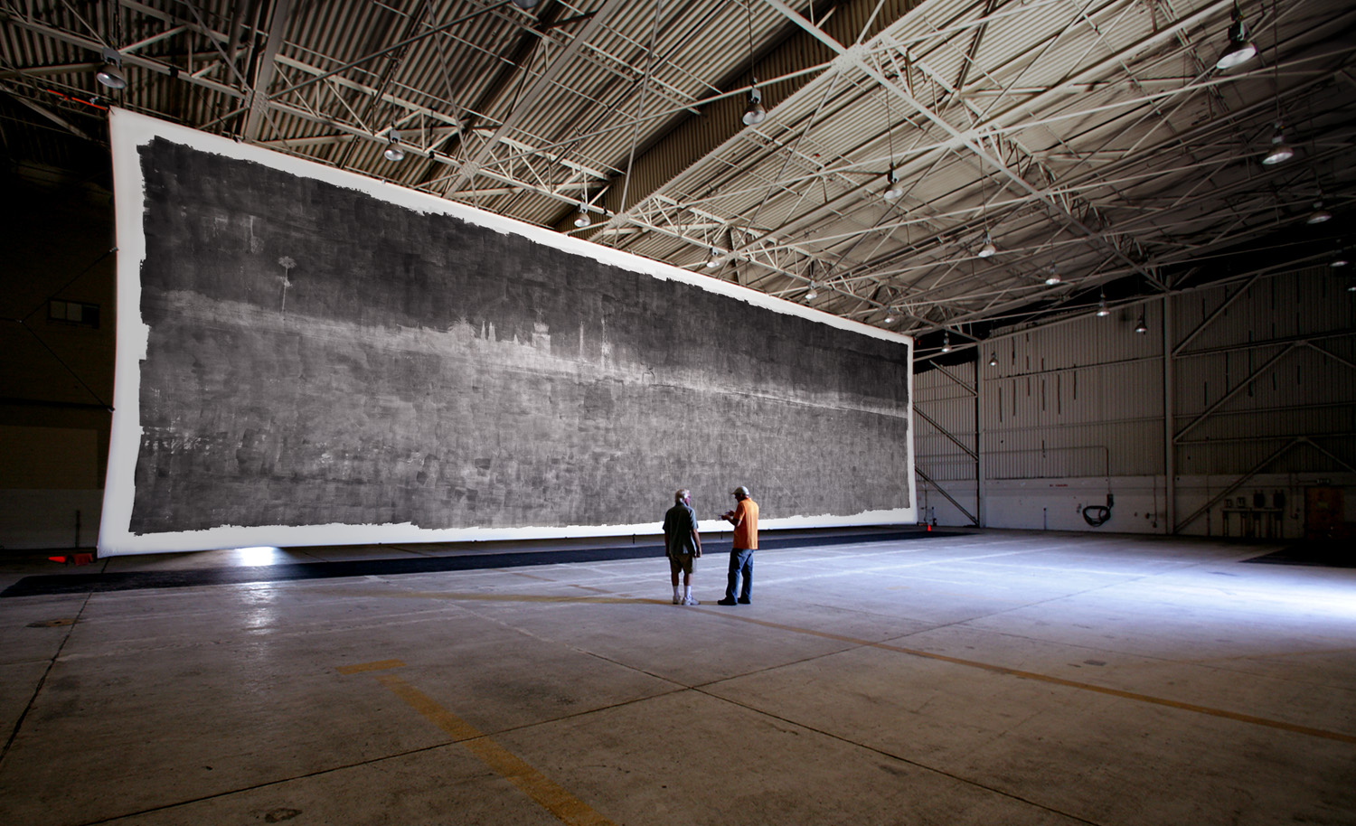The world record photograph - 32 feet by 111 feet - in place in the closed F-18 jet hanger used as a camera to make the image.