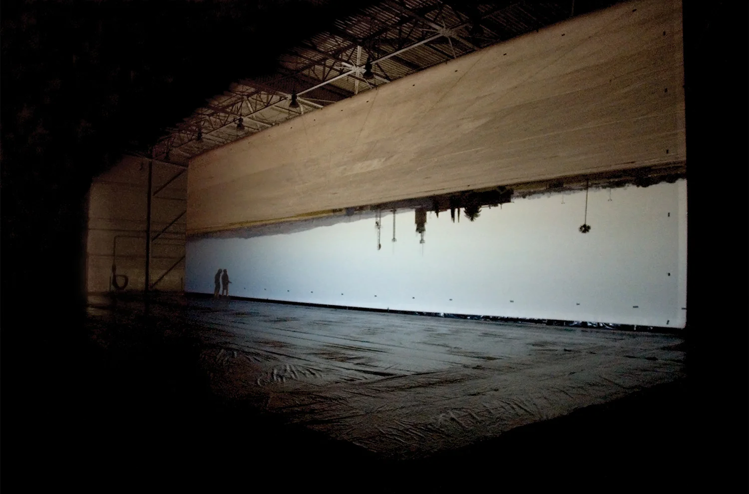 For a time, the building was a tremendous light sculpture. After twenty minutes of becoming adjusted to the extremely low light, the image glowed luminously on the huge suspended fabric.