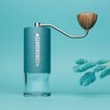 Alpine Lagoon Comandante C40 Hand Coffee Grinder MK4 featuring high quality stainless steel burrs and an ergonomic design ideal for precise and consistent grinding for coffee enthusiasts 