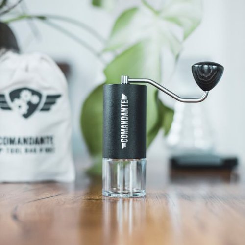 Black Comandante C40 Hand Coffee Grinder MK4 featuring high quality stainless steel burrs and an ergonomic design ideal for precise and consistent grinding for coffee enthusiasts 