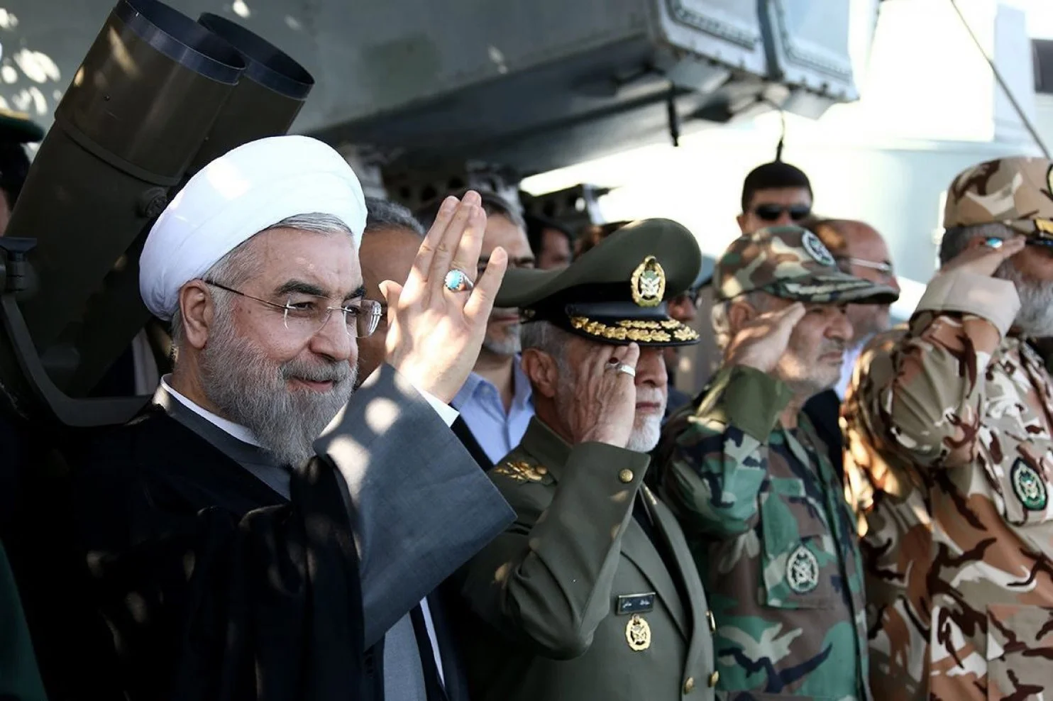 Iranian President Hassan Rouhani, left, at a navy parade in December in the city of Bandar Jask. In her book, Nazila Fathi describes Iran’s fluid politics. (Official Presidential Official Web site via european pressphoto agency)