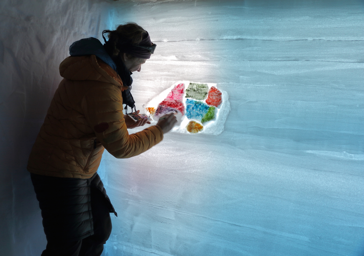 Scientist Erin Pettit expressing her inner artist inside a snowpit at WAIS Divide in January 2015.