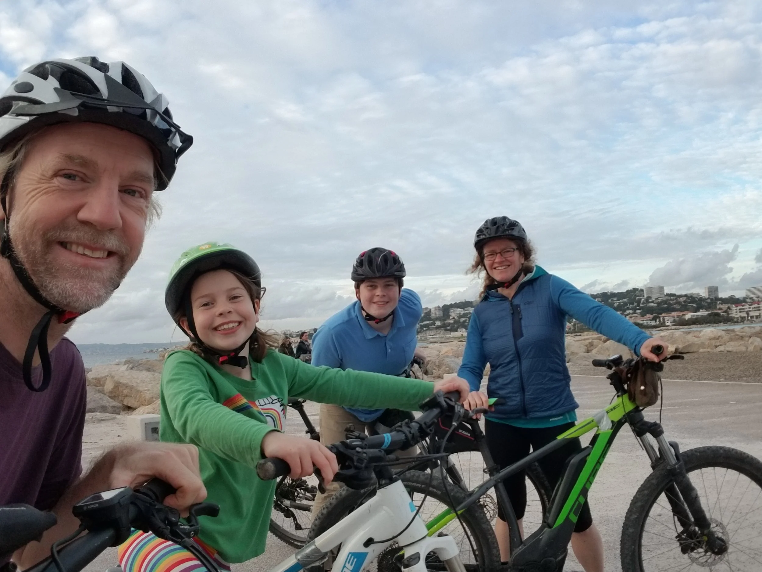 Back to sea level. (And almost back to the bike shop). Everyone still smiling except me. (they stuck me in a pannier - really?)