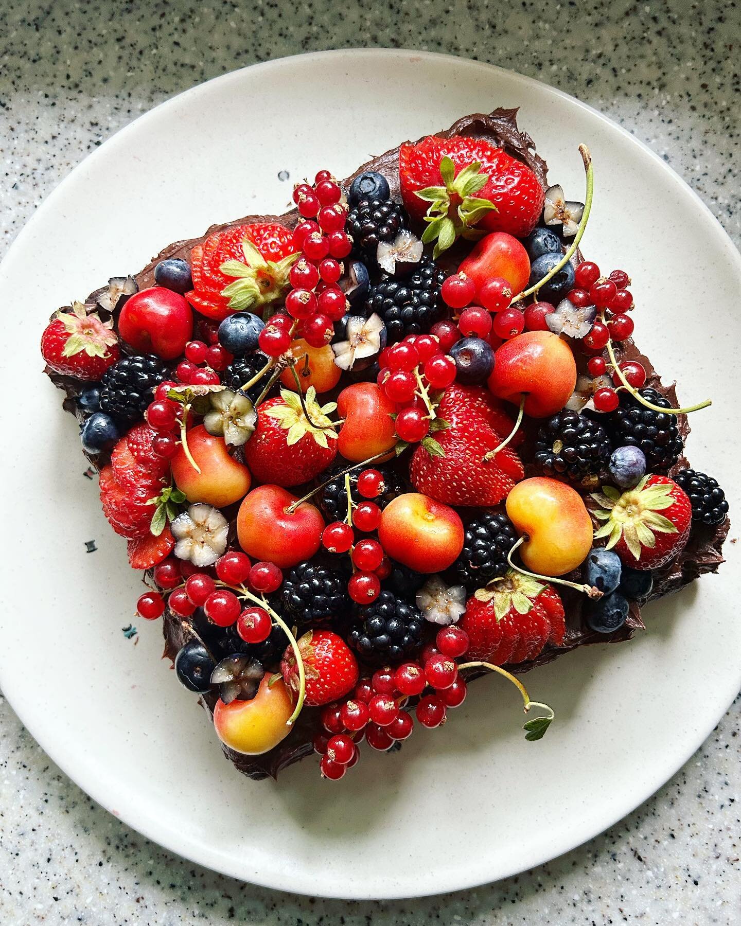 When my niece requests a chocolate cake with chocolate frosting with berries, she gets a chocolate cake with chocolate frosting with berries. 

Cake recipe from the A+ @smittenkitchen Every Day cookbook. Topped with Ranier cherries, strawberries, bla