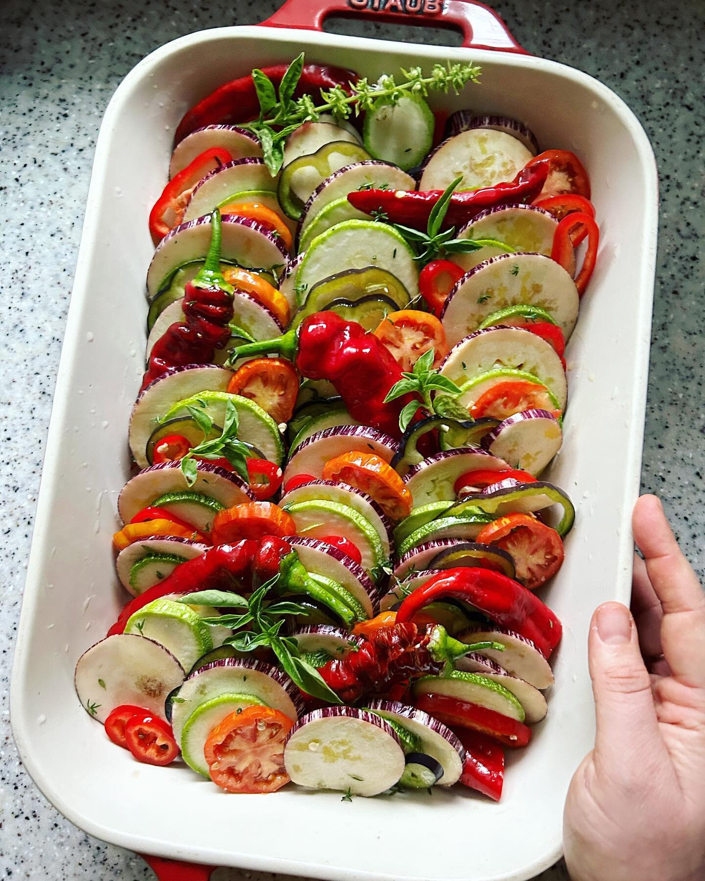 In a recent conversation on @foodfriendspod, @karilauritzenla inspired me to make one of my favorite September dishes: ratatouille. 🍅🫑

Inspired by @smittenkitchen&rsquo;s version (inspired by the movie version), I layer eggplants, peppers, zucchin
