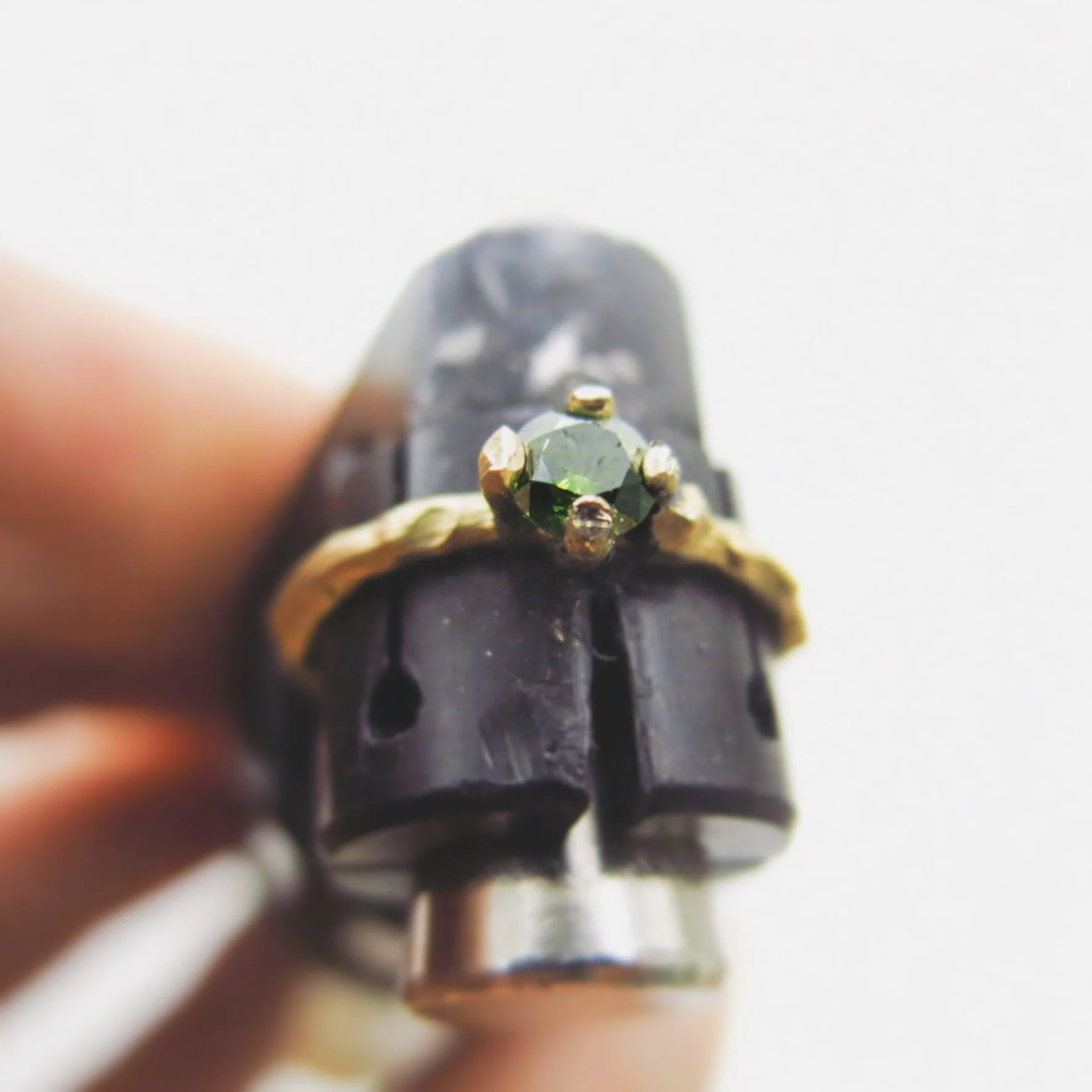 Twiggy ring with green diamond