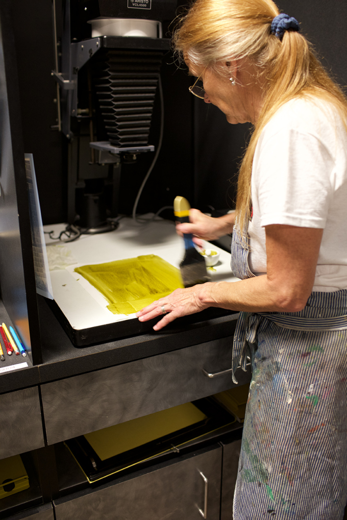 Marina Bartolomeo brushing on a gum layer, Art Intersection