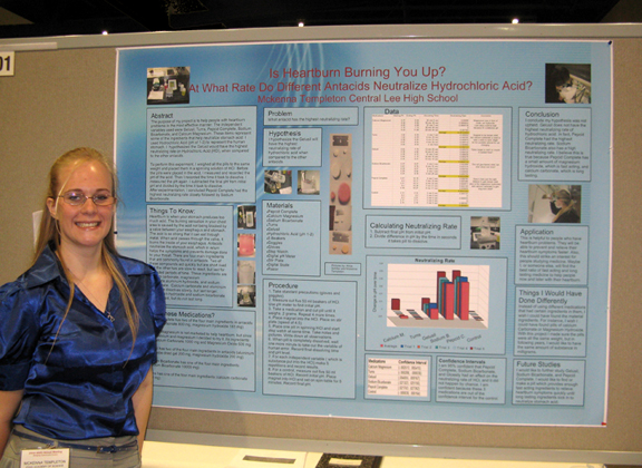 McKenna with her poster at the AmJAS/AAAS Annual Meeting