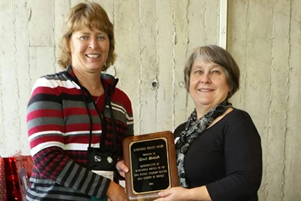 Traci Maxted (R), Cedar Rapids Jefferson High School receives an Outstanding Service Award from Nadine Weirather, President of the Iowa Academy of Science