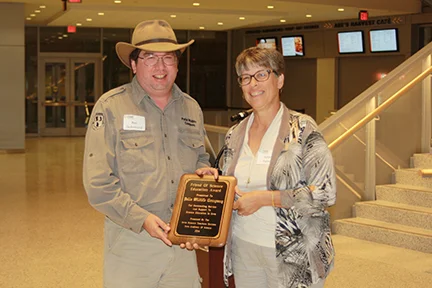 Ron De Armond, CEO, Pella Wildlife Company accepting Corporate Friend of Science Award from Kelen Panec.