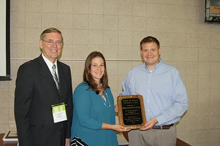 2015 Corporate Friend of Science Award was presented to Indian Creek Nature Center. Pictured from left to right: Craig Johnson, Iowa Academy of Science Executive Director, Jennifer Rupp, Indian Creek Nature Center Program Specialist and John Myers, …
