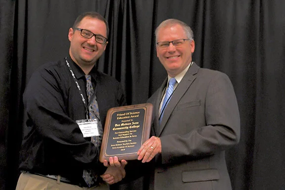 2019 Corporate Friend of Science Award was presented to Des Moines Area Community College by Jesse Wilcox, Chair of the Iowa Science Teaching Section. Accepting for DMACC was Scott Schultz (R), Academic Dean of the Science, Engineering, Math, and So…