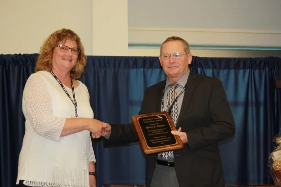 2017 Individual Friend of Science Award was presented to Bryon Lyons (R), plant foreman at Traer Municiple Utilities, by Lisa Chizek, Chair of the Iowa Science Teachers Section