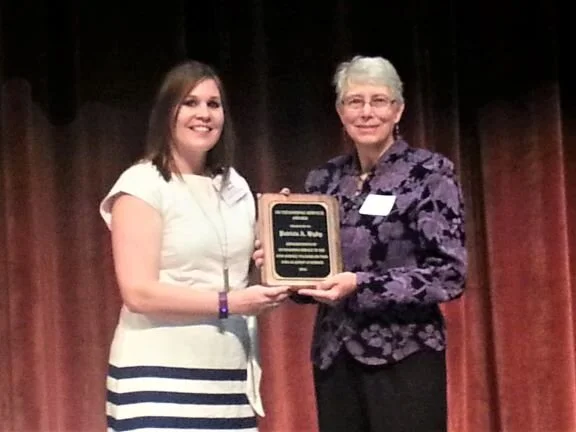 Pat Higby (R), Energy Educator at UNI’s Center for Energy &amp; Environmental Education (CEEE), received the 2017 Outstanding Service Award from Stacey Rivera, Chair of the Iowa Science Teachers Section.