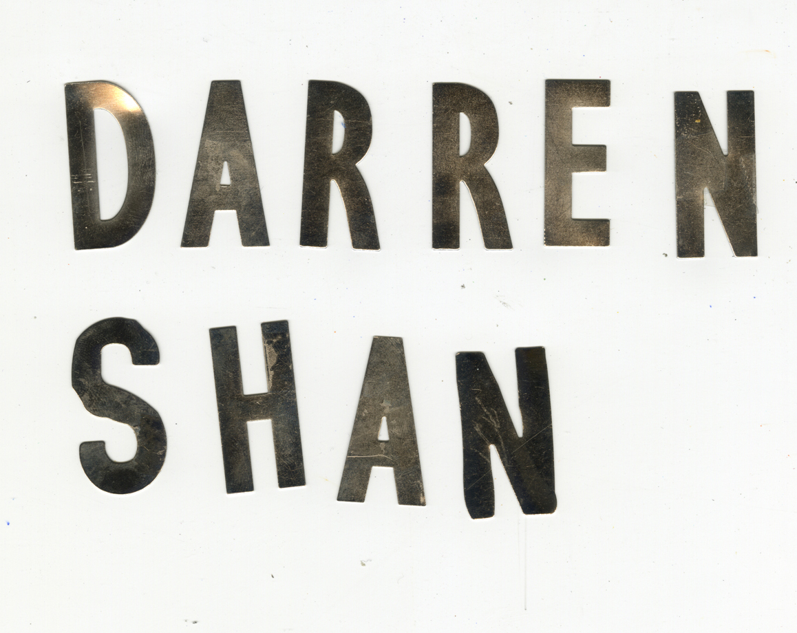 I had these small metal letters which I decided to use as shadow puppets to create the title.