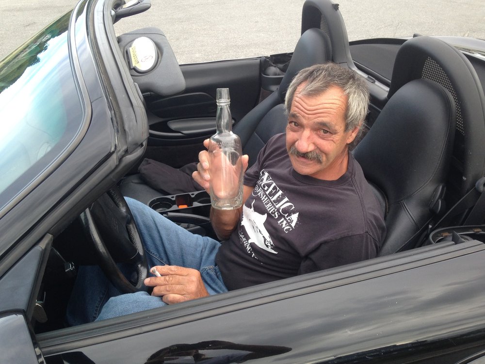  Peter Parisi, a Gloucester fisherman, donates a glass bottle he caught at sea. The markings on the bottle identify it as a rum bottle from between 1935-1964. Peter thinks a fisherman was drinking out at sea and cast this bottle overboard after finis