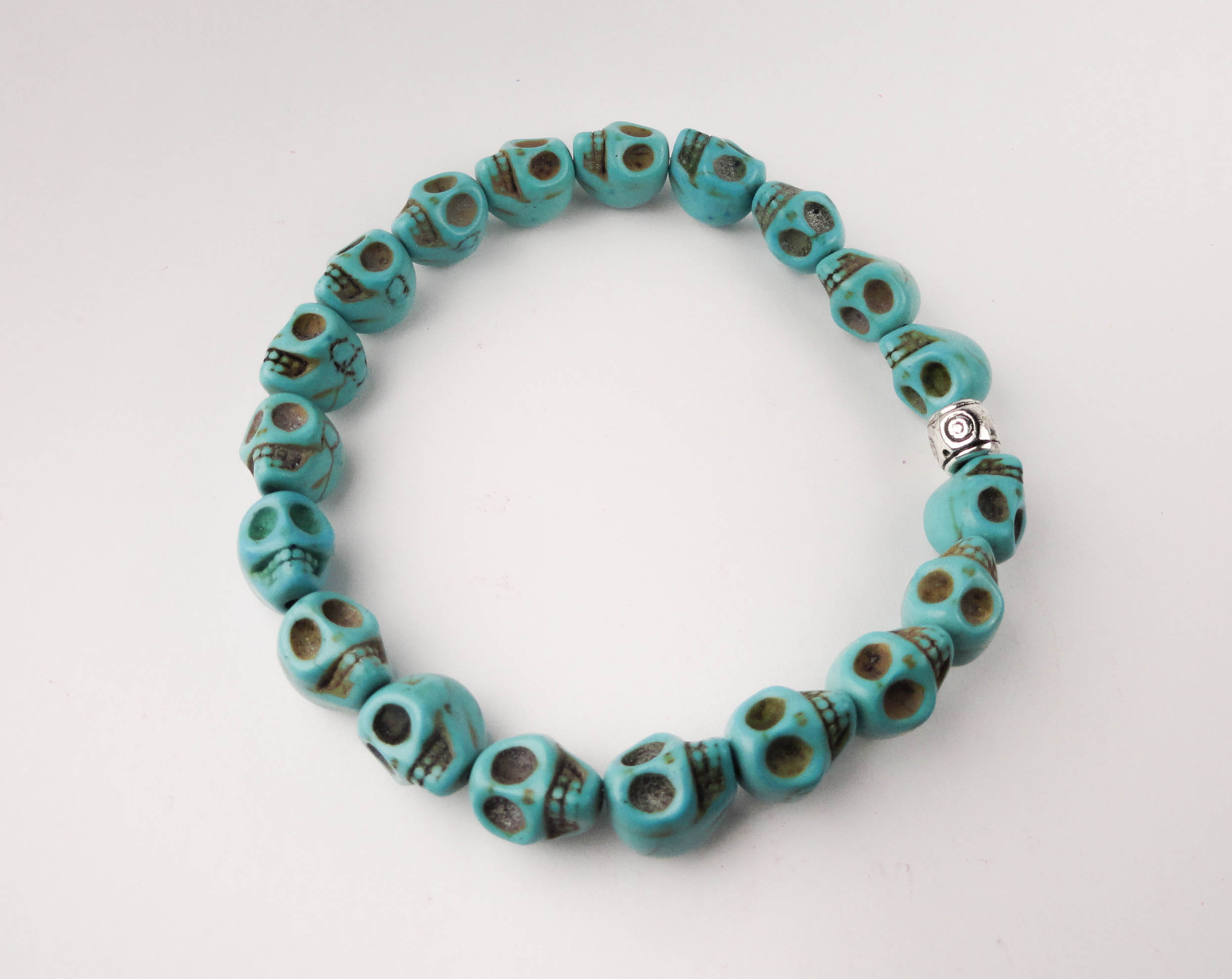 SkullSmTurquoiseSingle-Website.jpg