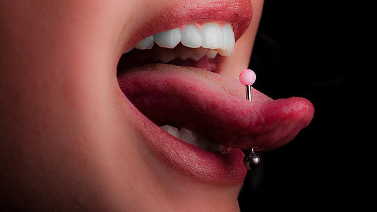 warns on the hidden side of tongue piercing