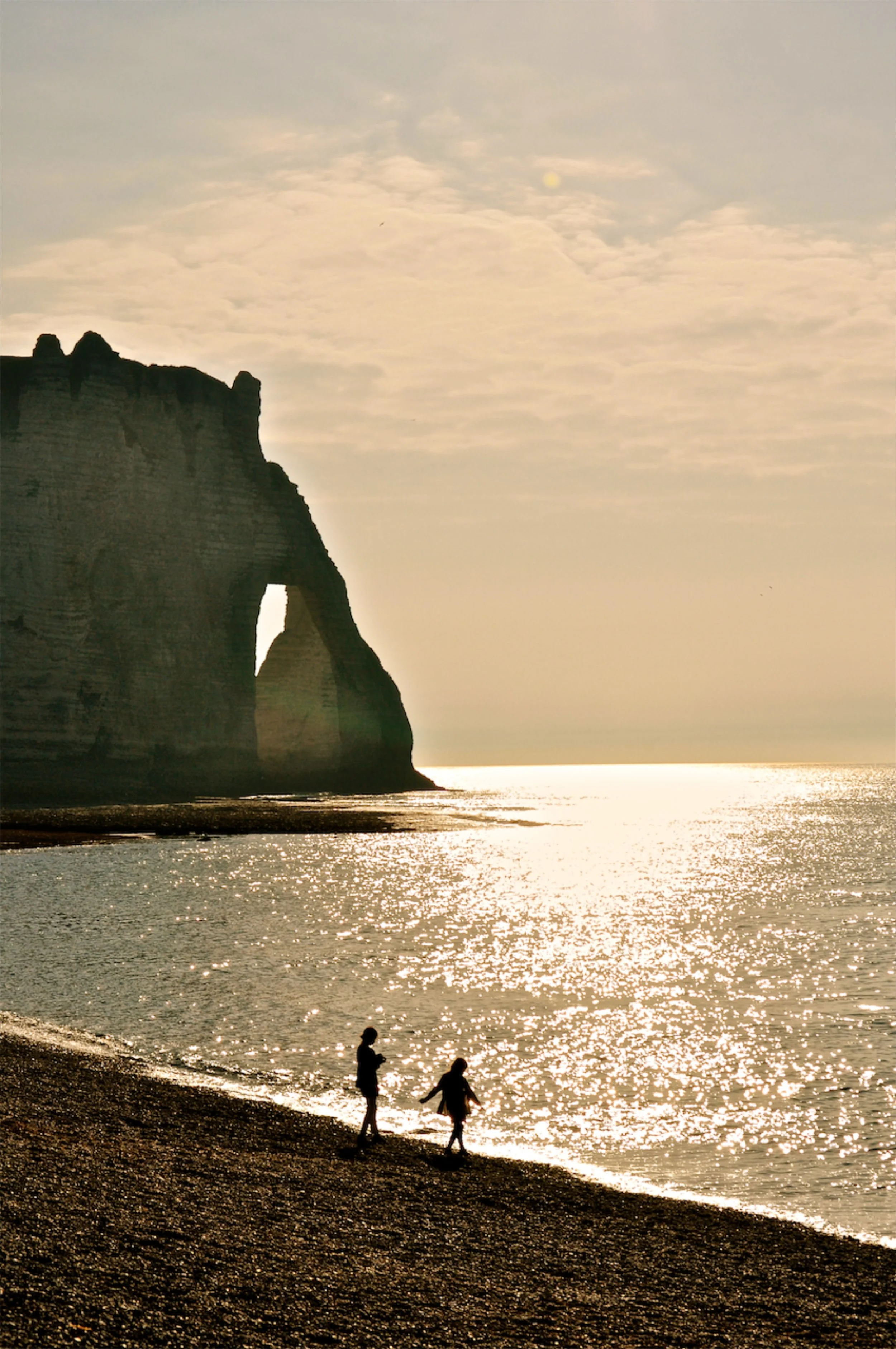 Mom. Daughter. Playful. Sunset. Etretat. France. 