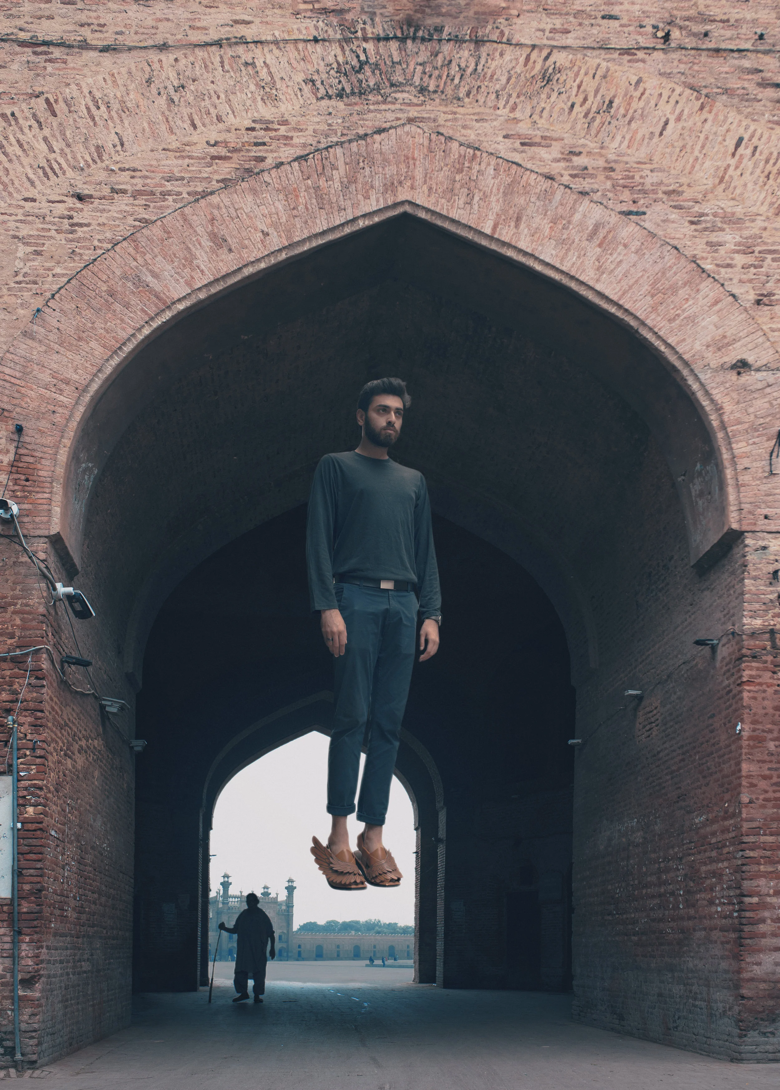 Hovering in front of Brick Arch Tan Sandal.jpg