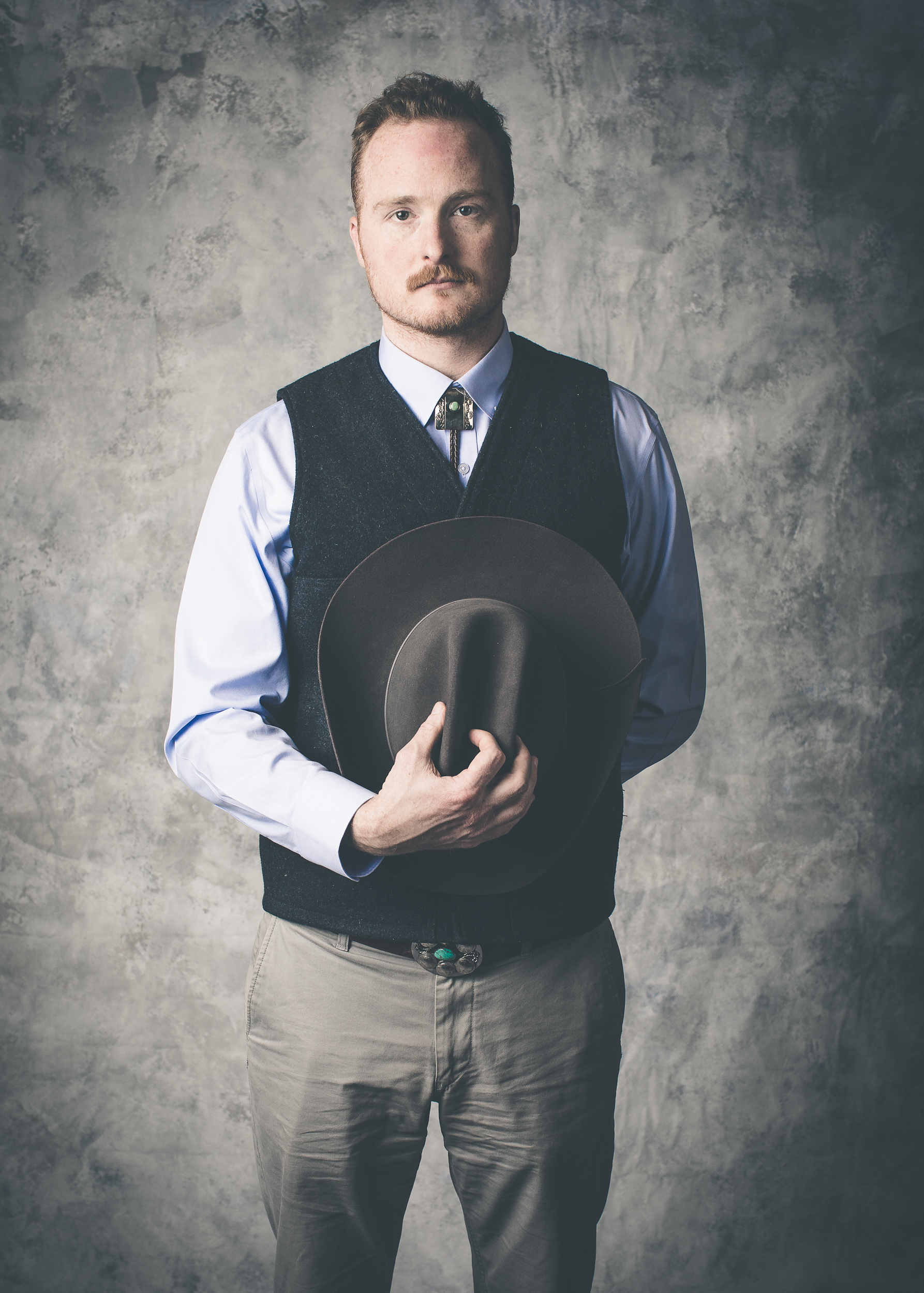 man-with-cowboy-hat-studio-portrait.jpg