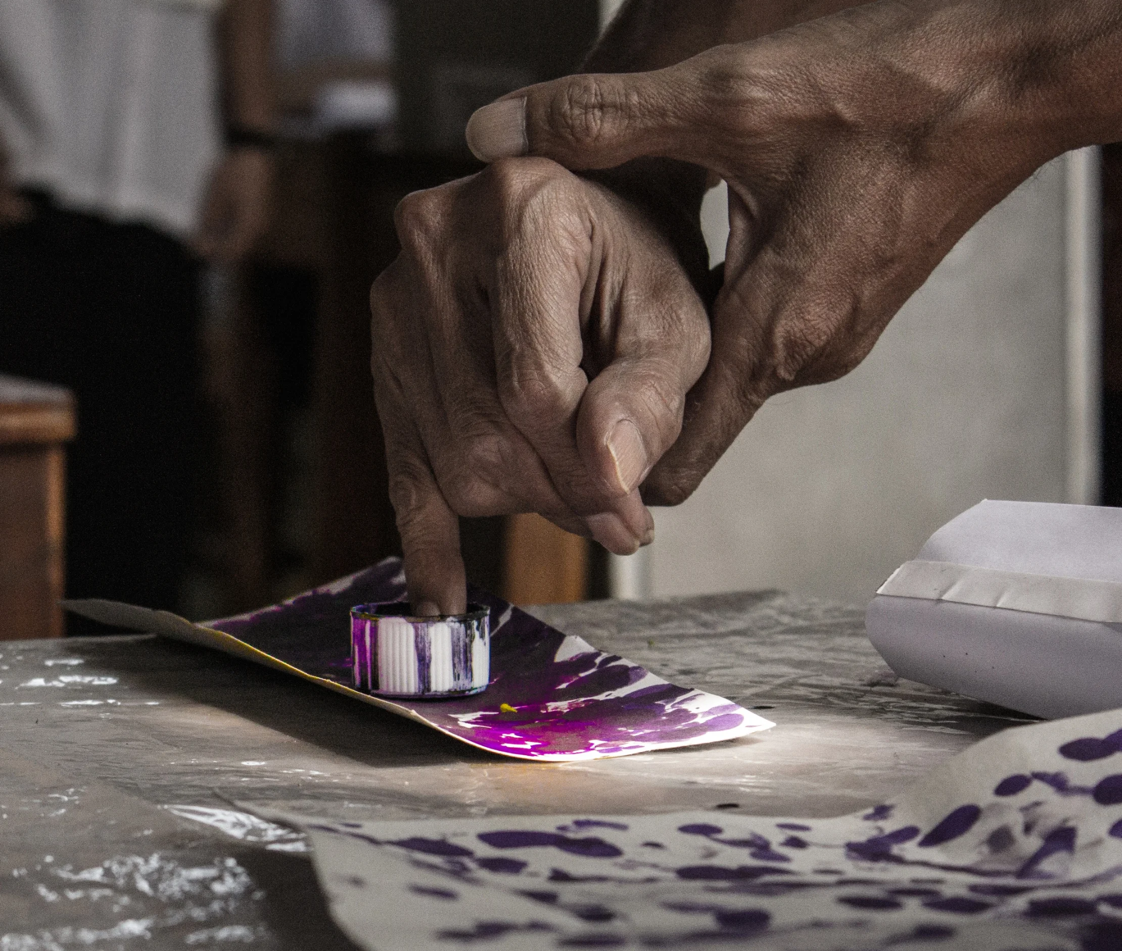  A woman dips her finger in indelible ink after voting. &nbsp;A common method in many countries (as well as being one of the most symbolic) this practice is one available mechanism for preventing double voting. It is especially useful if a country la