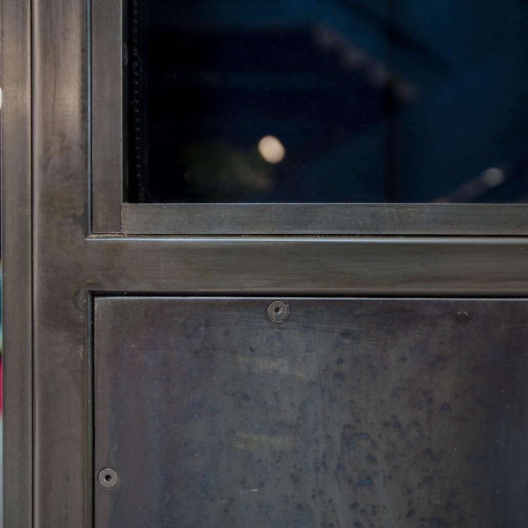 Close up of a blackened steel door. Some people are surprised to find out that steel is full of color and patterning. ⁠⠀
#Metal #MetalFabricator #custom #steel