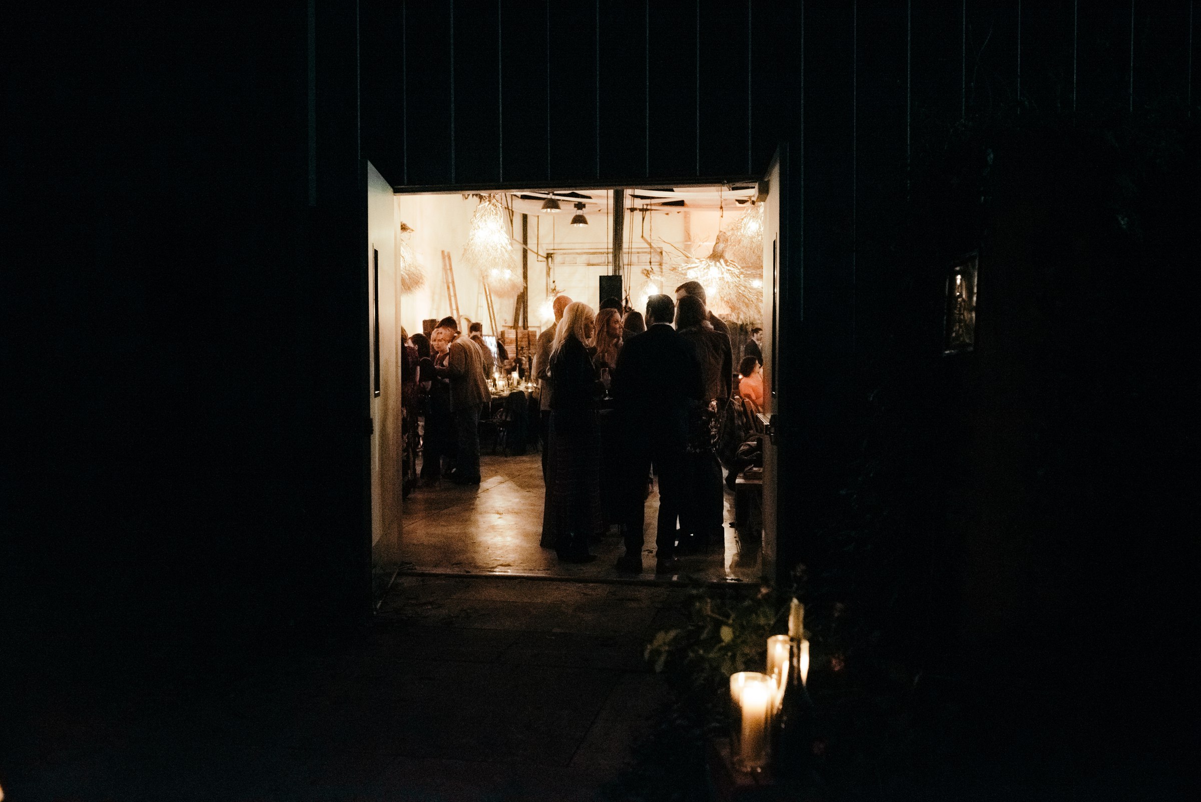  guests mingling inside vuka collective austin texas during wedding 