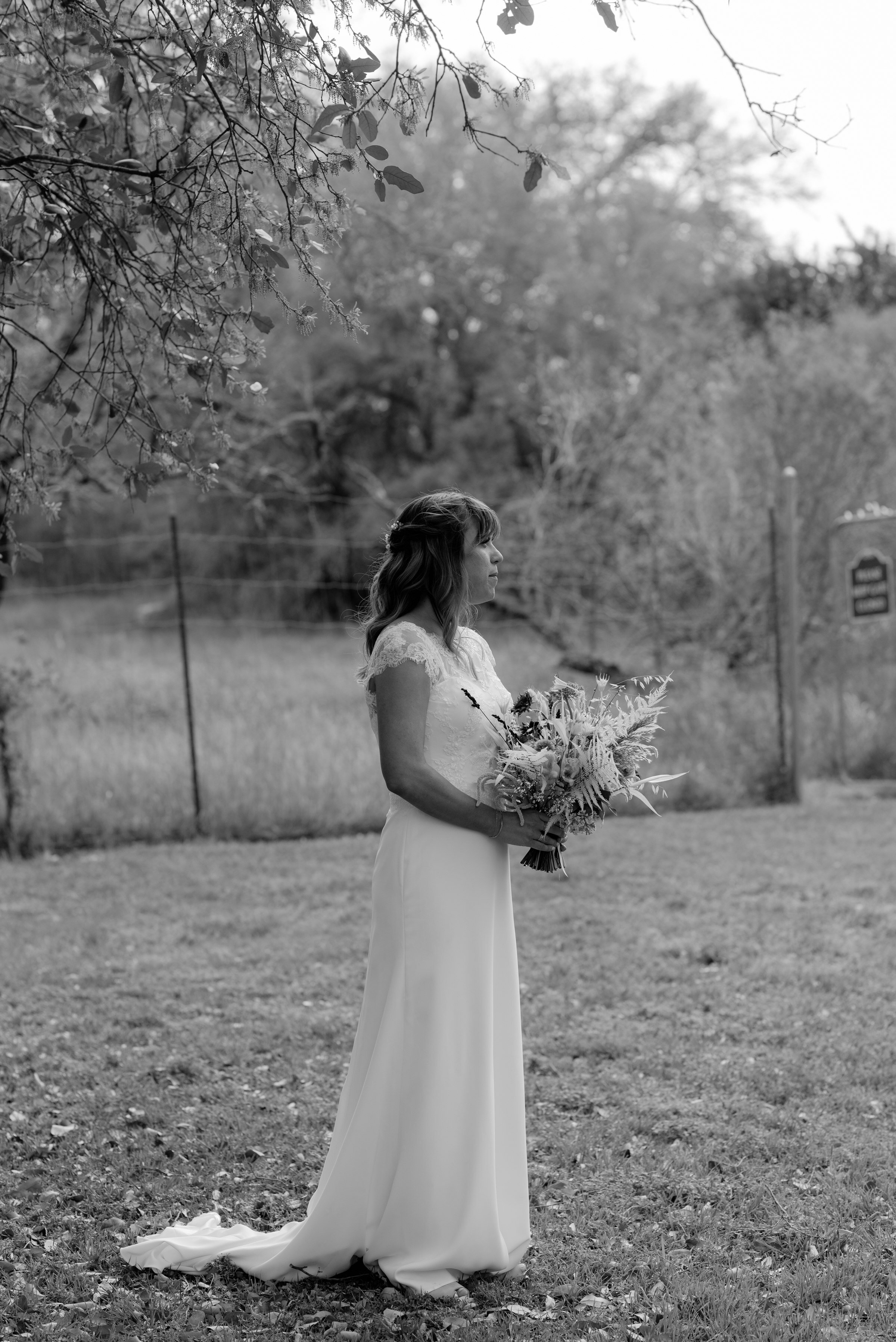  portrait of bride holding bouquet at plant at kyle wedding venue austin texas 