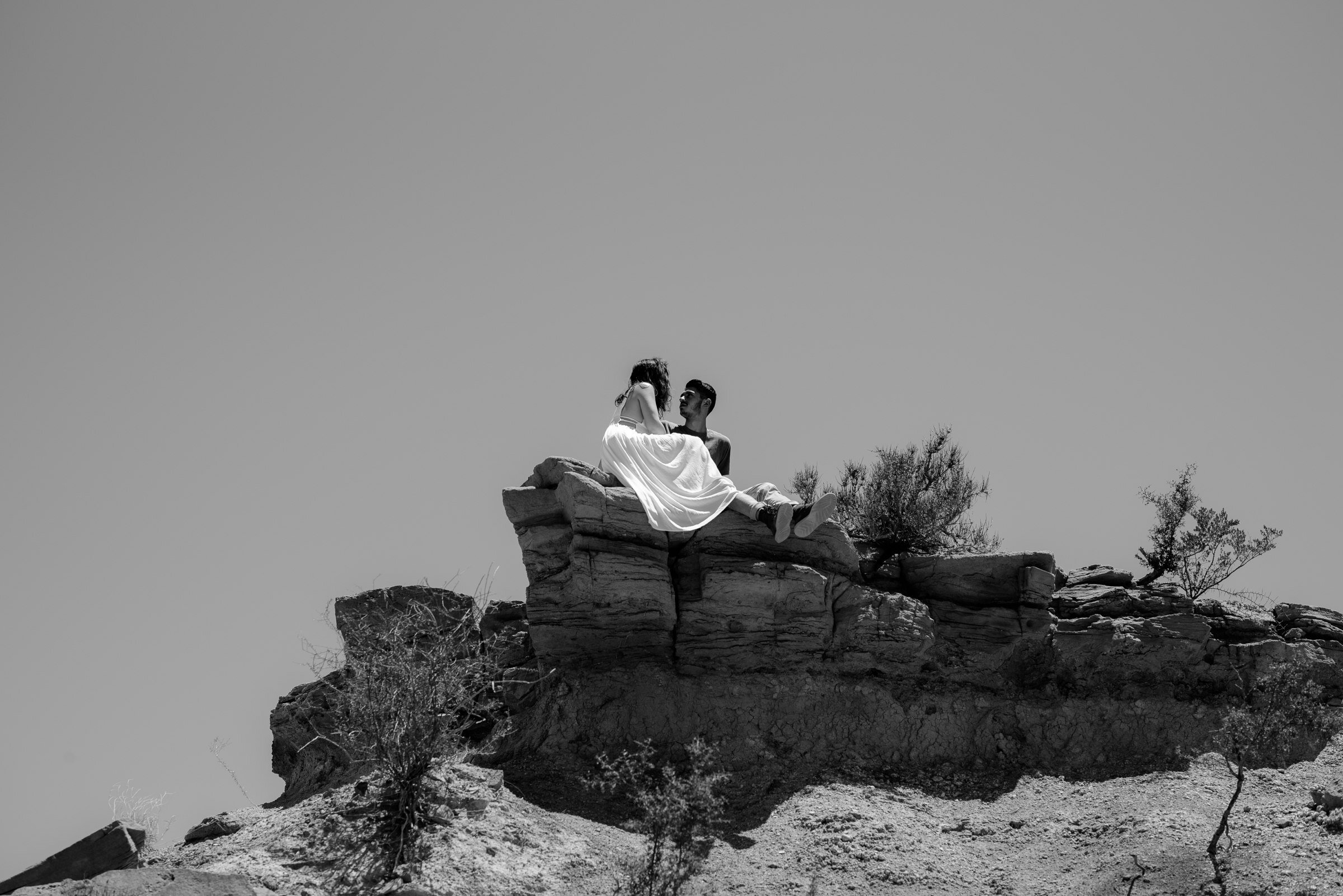  couple sitting on top of rock big bend national park engagement session 