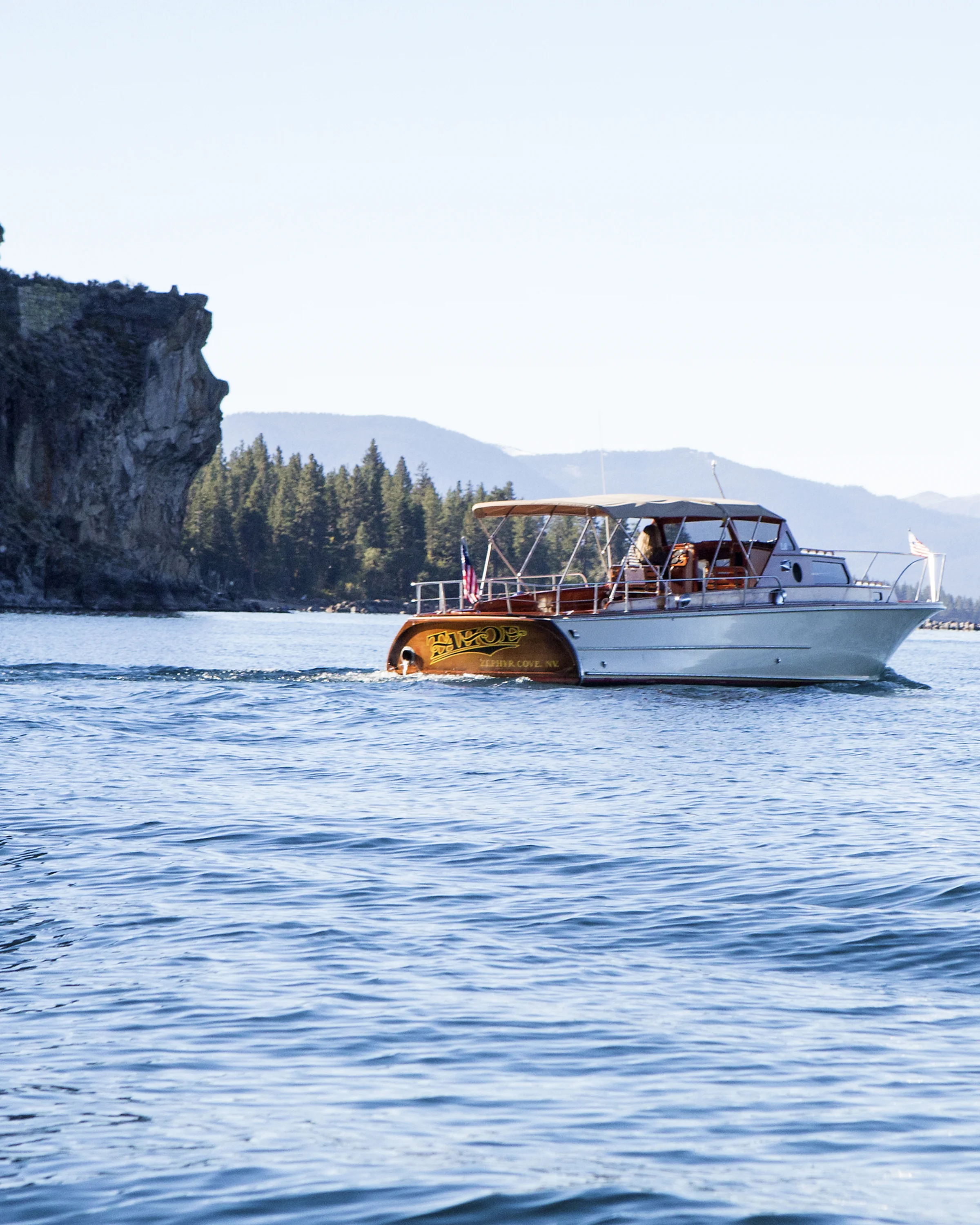The Tahoe passing the "Lady of the Lake" as she looks out on Lake Tahoe from Cave Rock.
