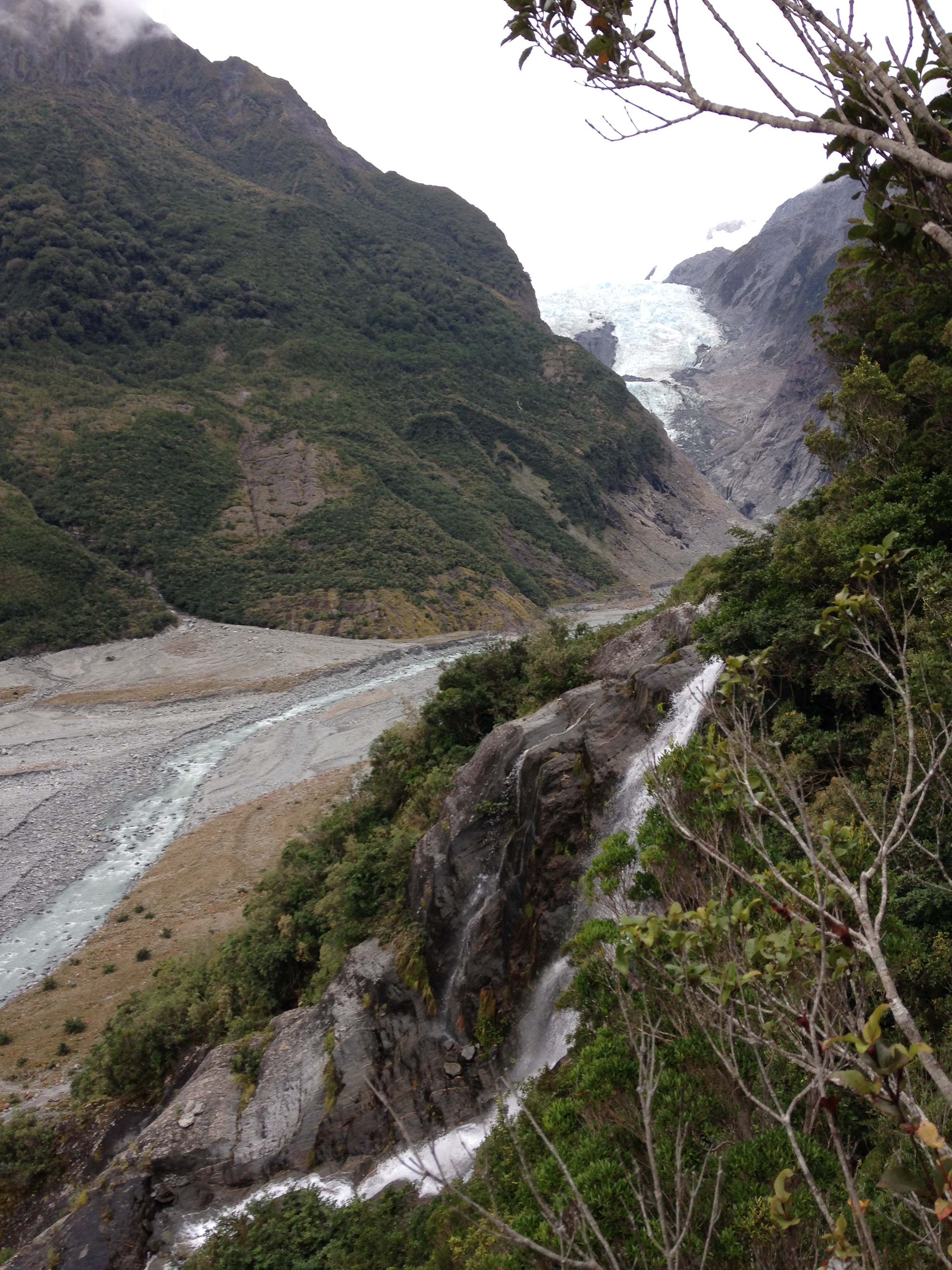By the waterfall on the Franz Joseph side mission, looking at the glacier. 