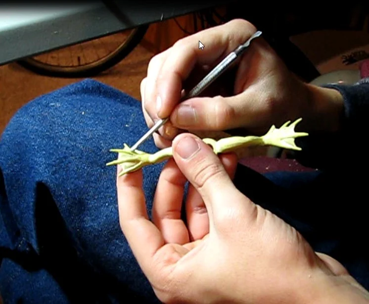 Sculpting the frog legs for the "Swampy Swimmer". The clay model is then used to make a silicone mold. I'll be putting together a "making of" video sometime soon.