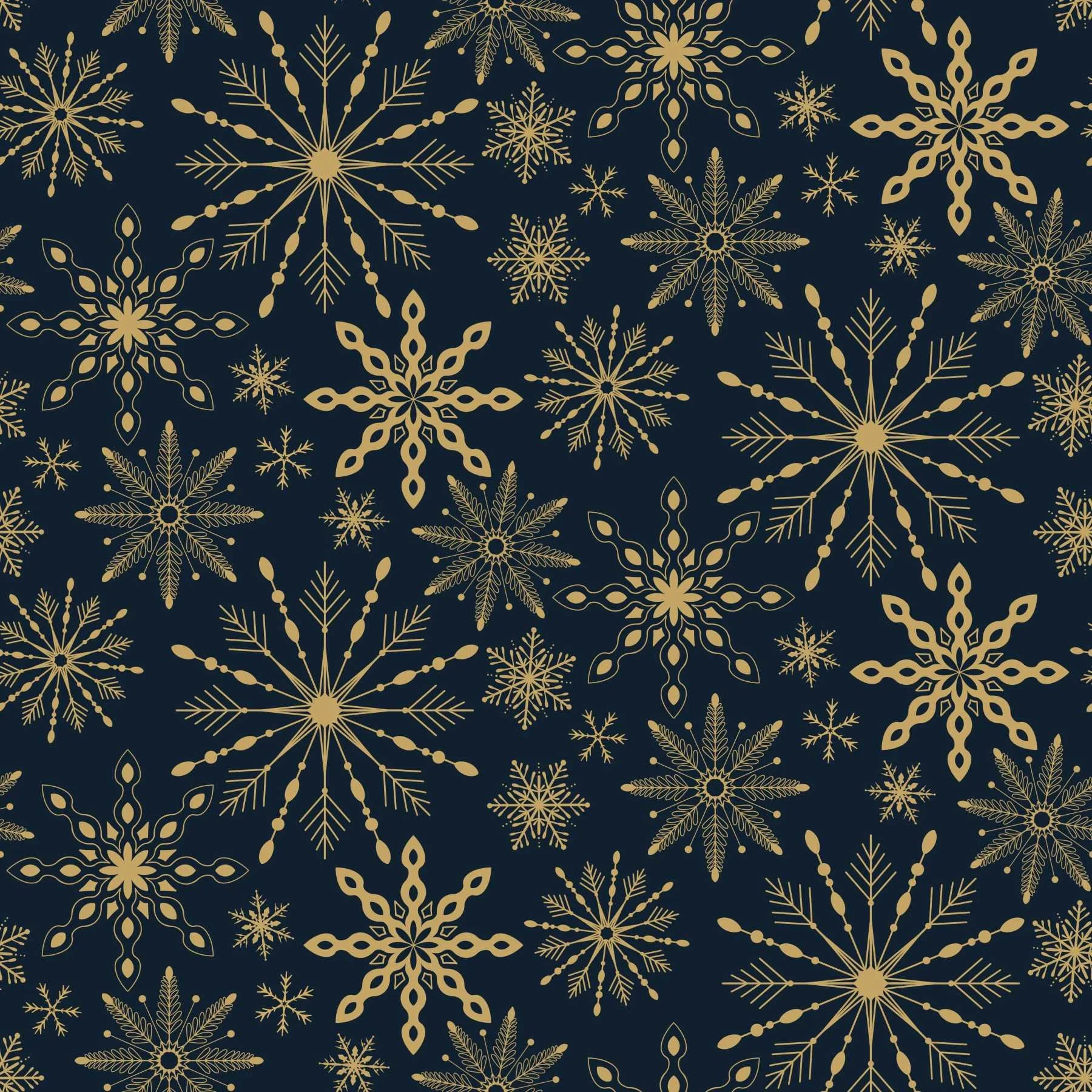 Repeat pattern of a variety of gold snowflakes scattered on a dark navy blue background.