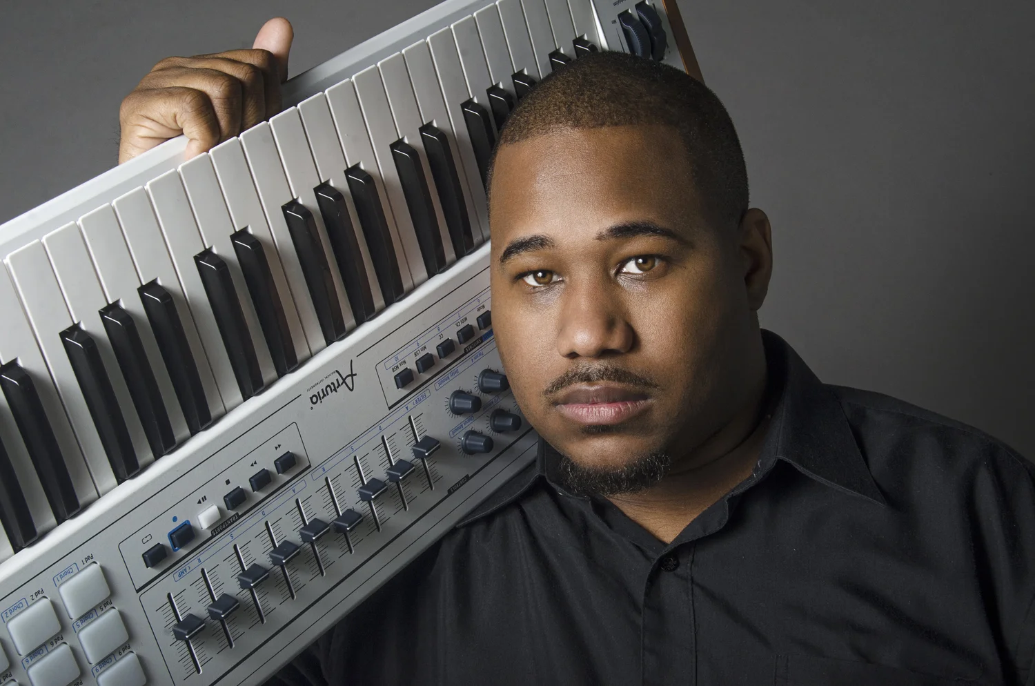 Junior Lee with a keyboard at Faithjunkie Productions