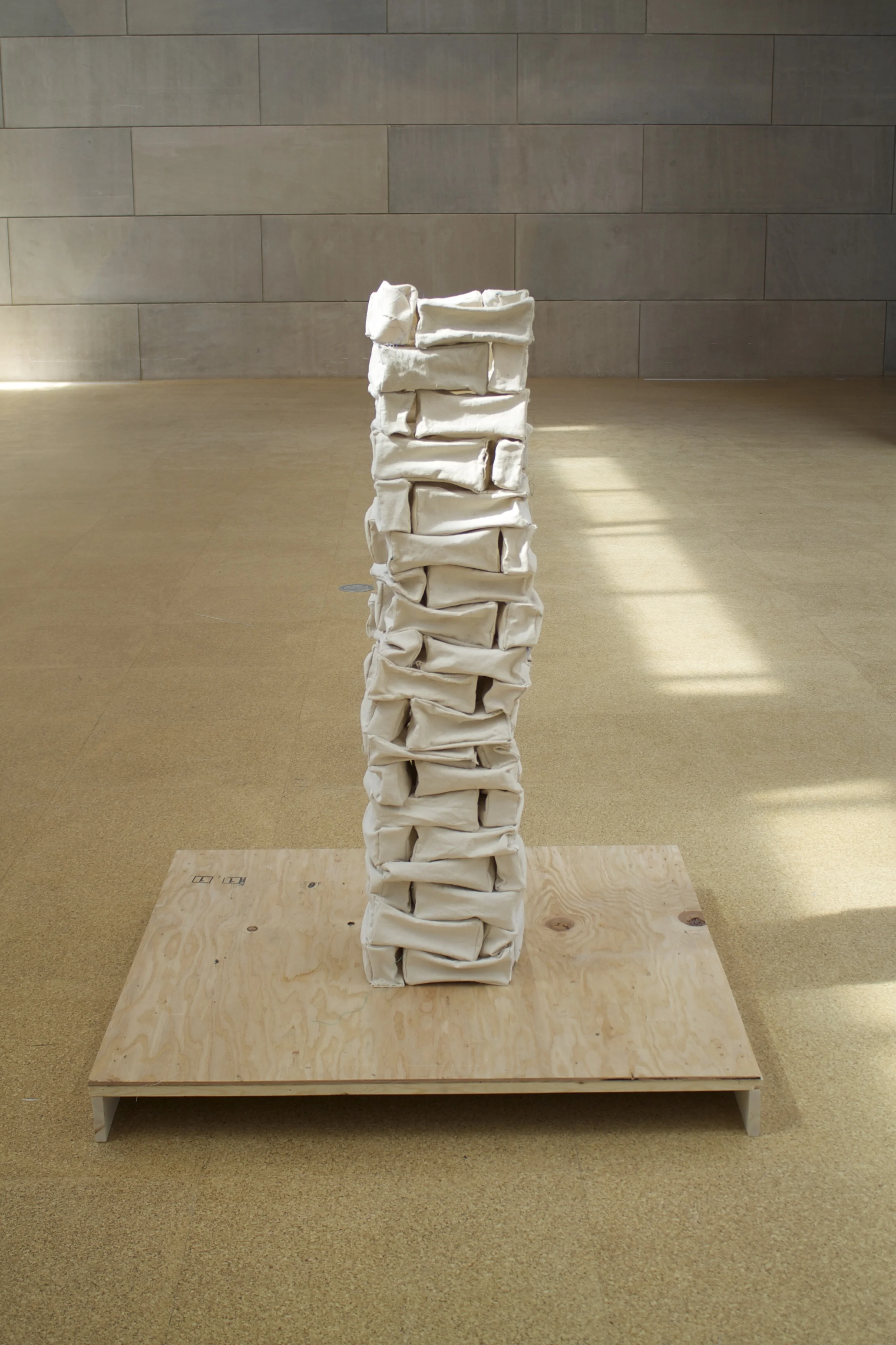  construct   canvas, thread, starch, wood, nails.&nbsp;  base: 46" x 43" x 3"  tower: 10" x 10" x 44" (soft) 