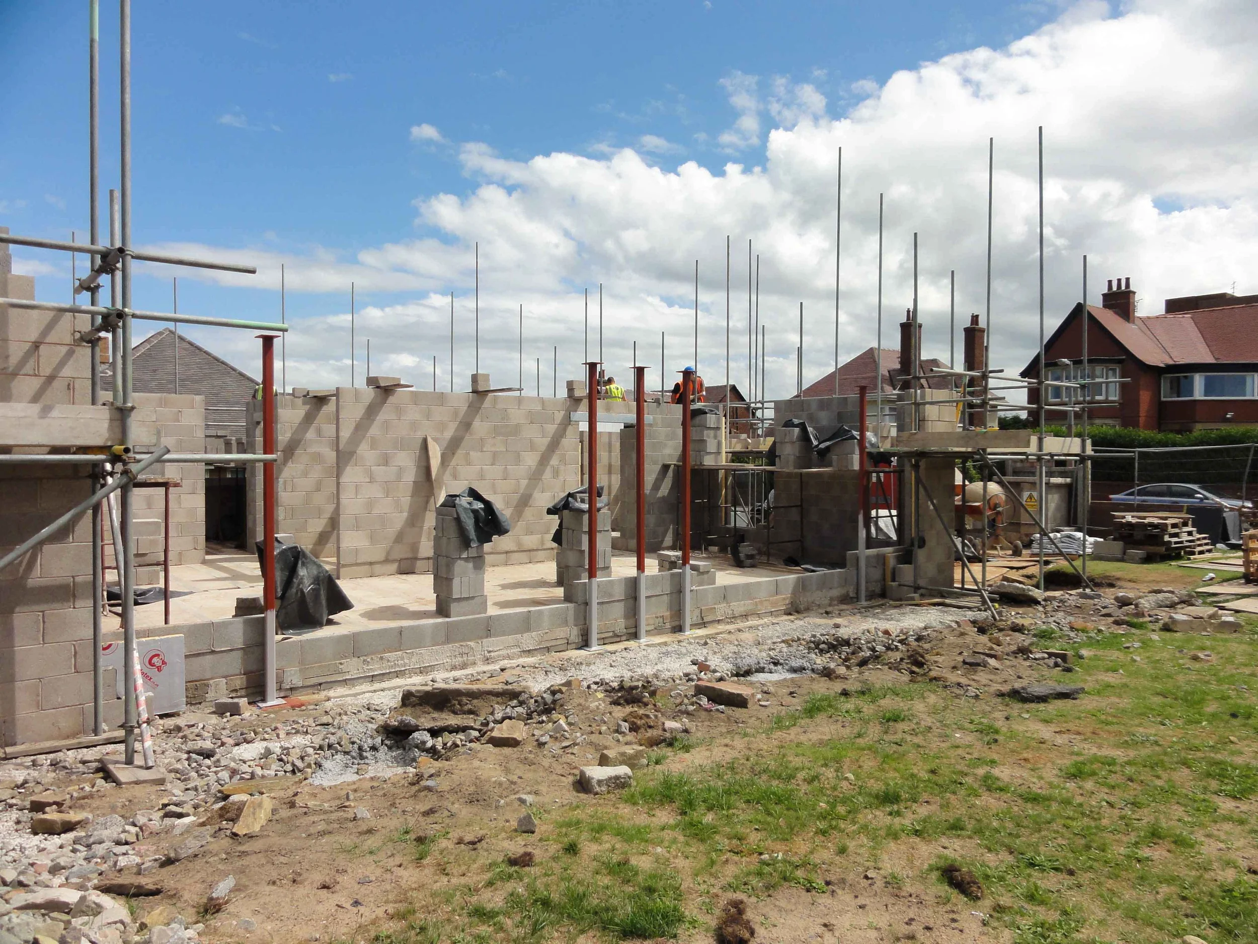 4.	First lift of blockwork going up, including steelwork. 